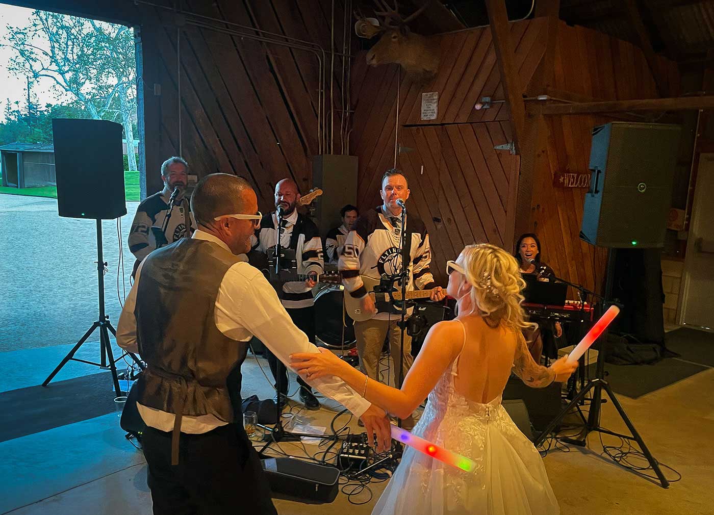 Bride and groom dancing in front of The Morning Spins band